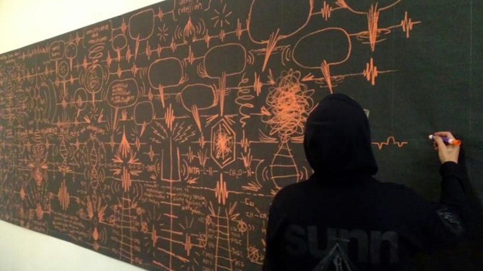 1. EKG. The artist draws at Pandemic gallery, 2013. Courtesy of the gallery.