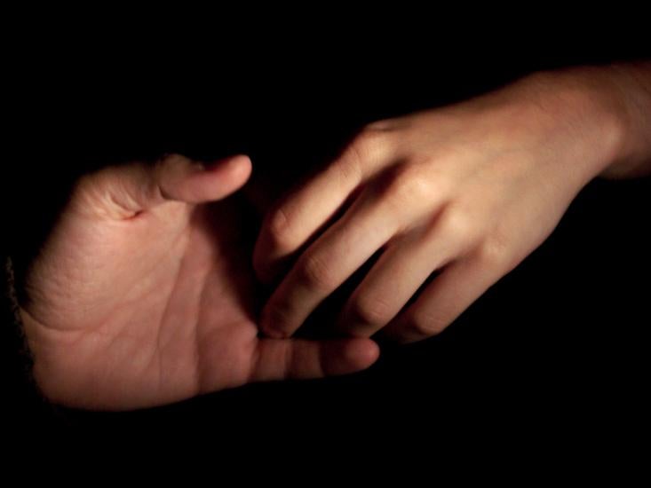 Hands touching