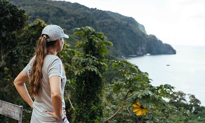 A photo of Dona Bertarelli looking out over the water from the shore.