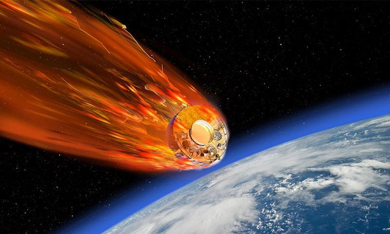 An illustration showing a chunk of space garbage hurtling toward Earth.